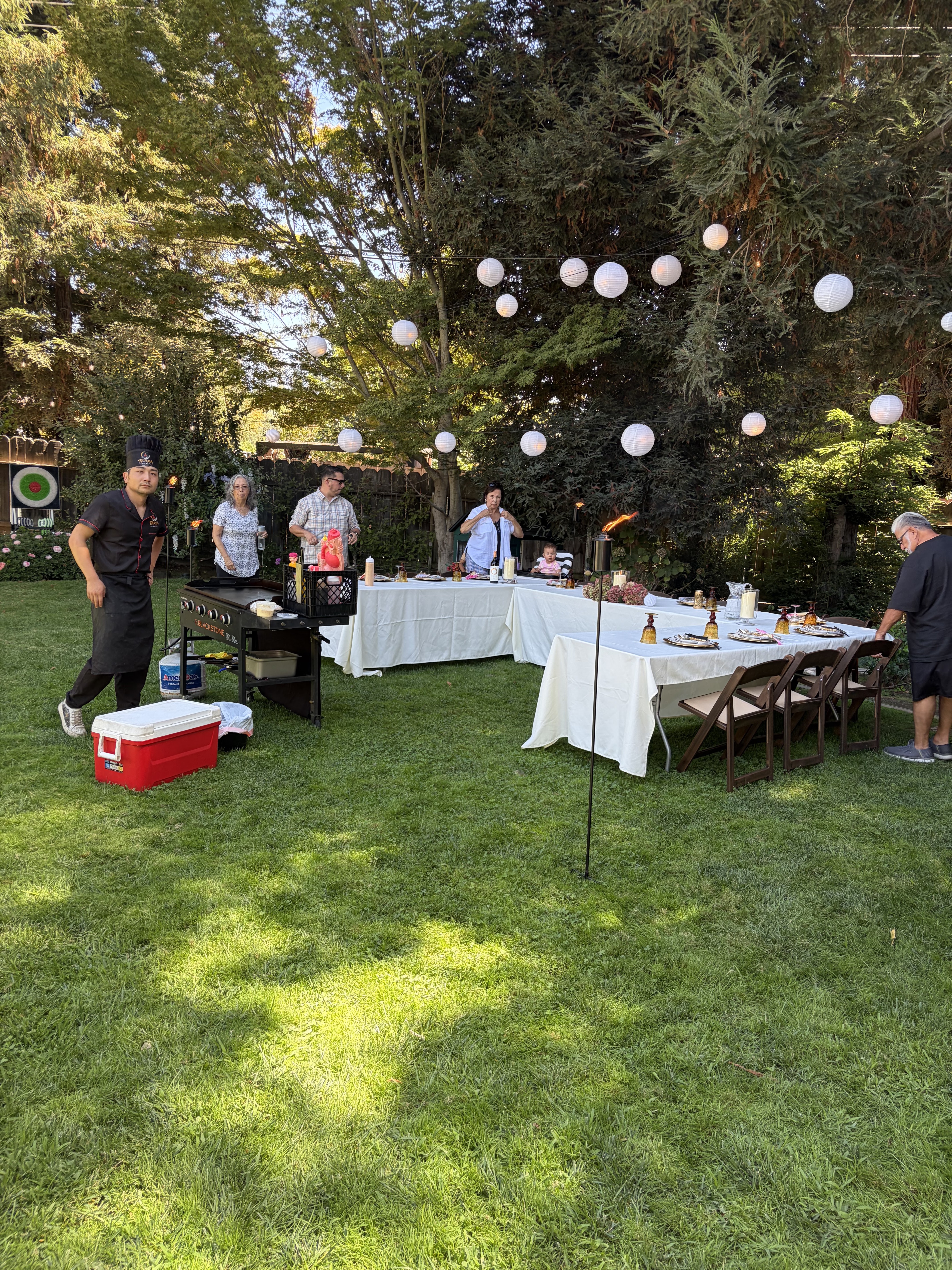 Wide lawn hibachi party with guests in Vacaville, CA