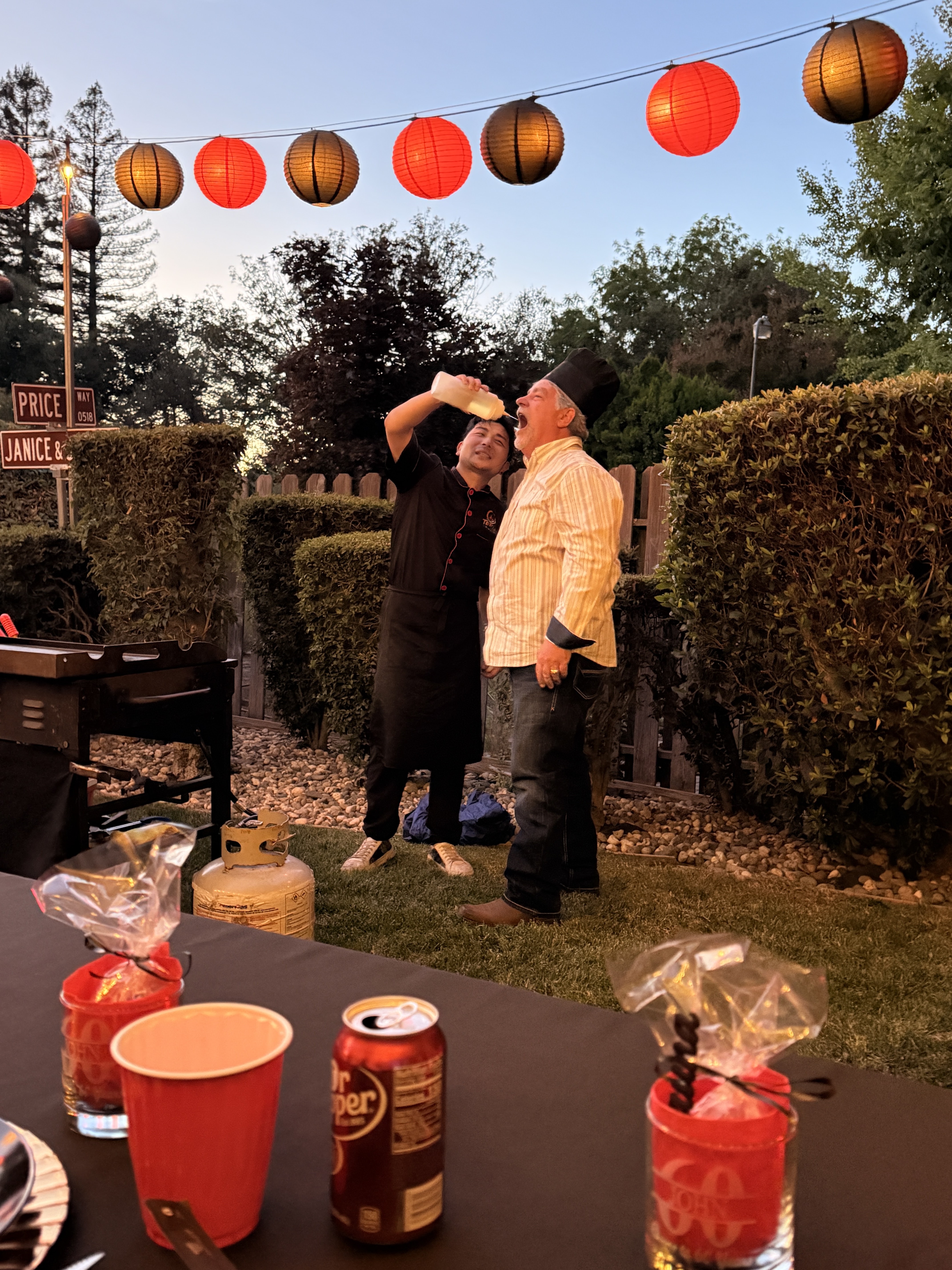 Sake pour celebration during a backyard party in Turlock, CA